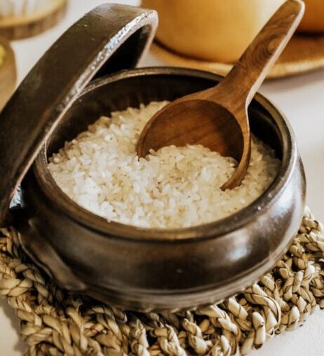 A table with a bowl of salt and a spoon