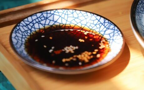 Round Blue Saucer Filled With Soy Sauce