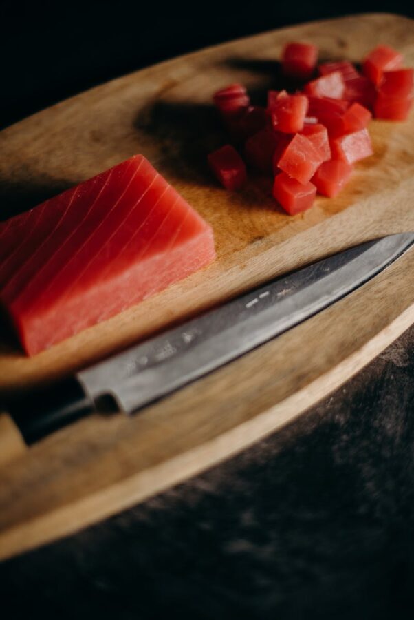 Sliced Meat on Brown Wooden Chopping Board